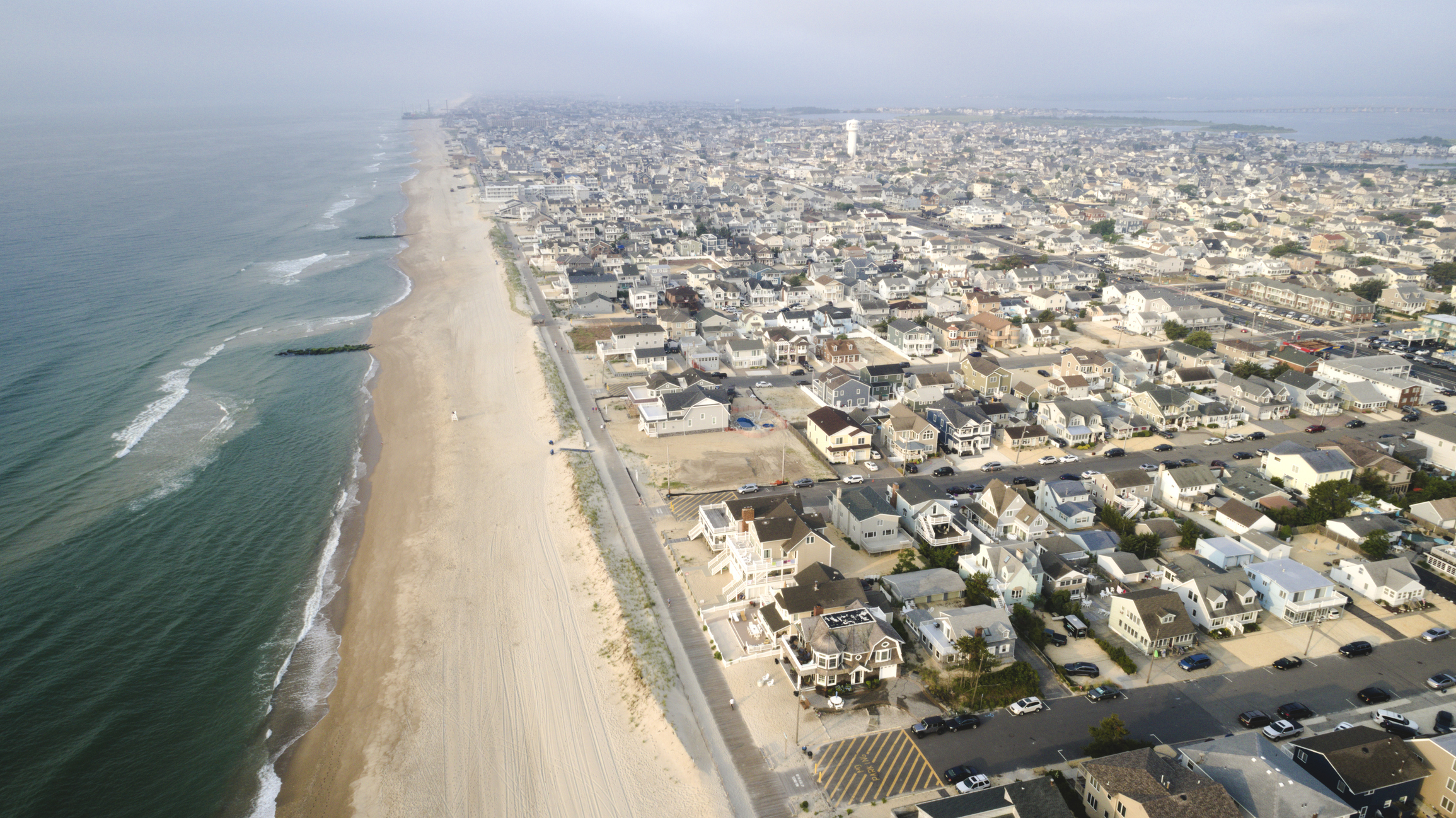 Aerial view of a quiet Delaware beach town — year-round social media for seasonal businesses