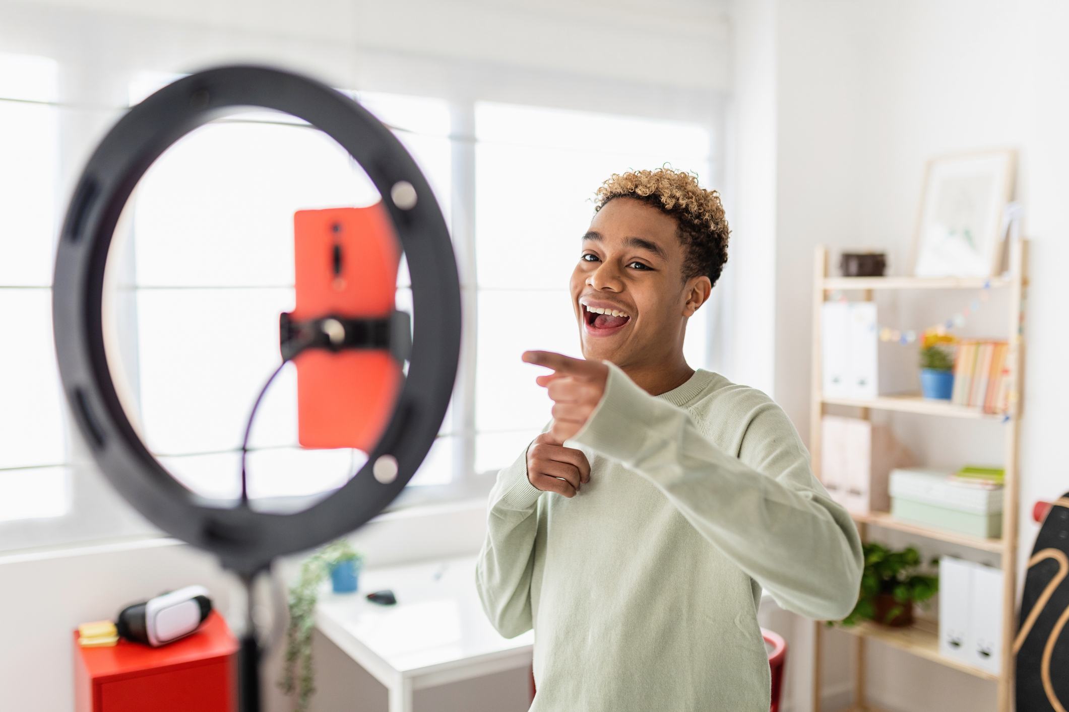 Content creator filming a video with a ring light — TikTok vs Instagram Reels in 2026